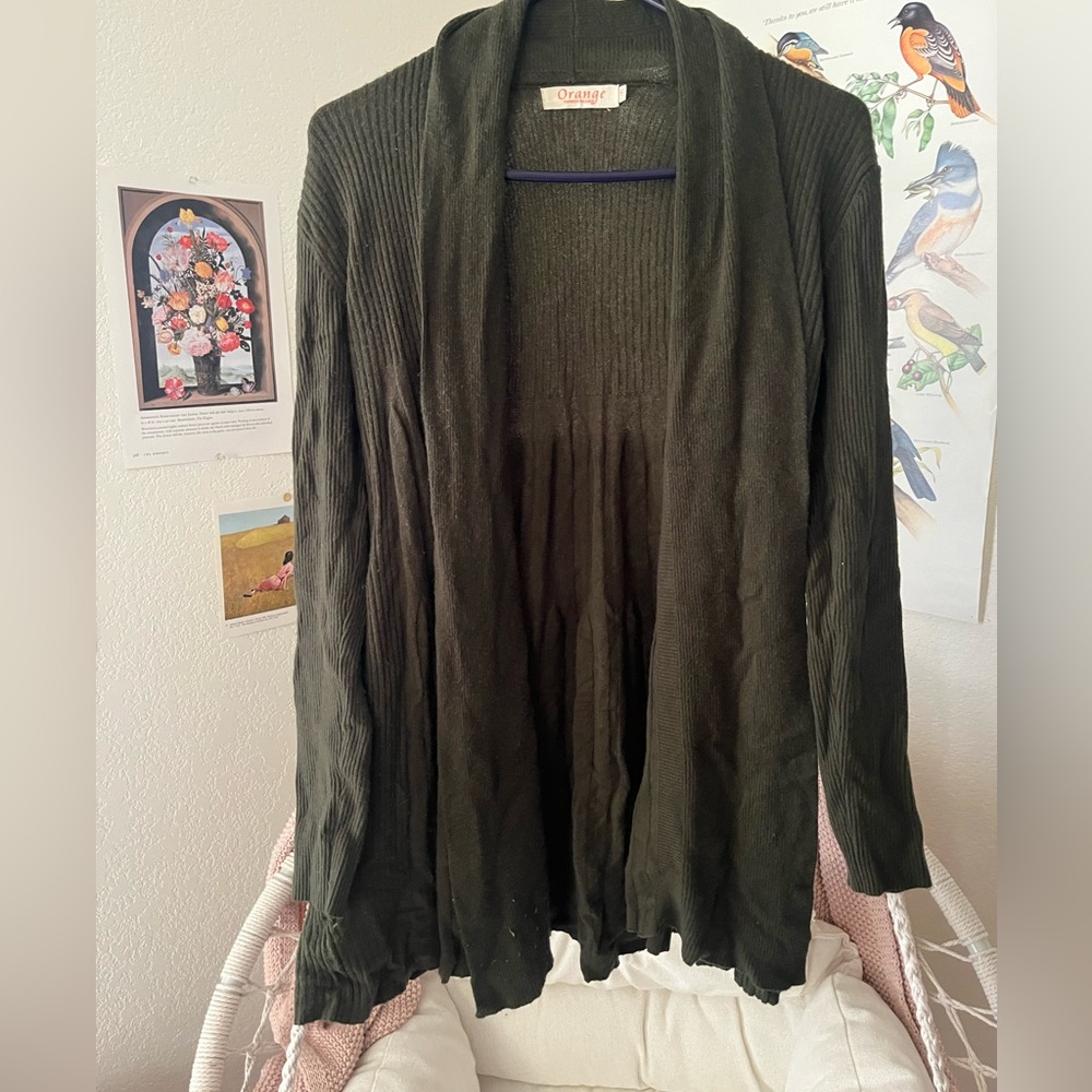 Woman’s green cardigan with flower details